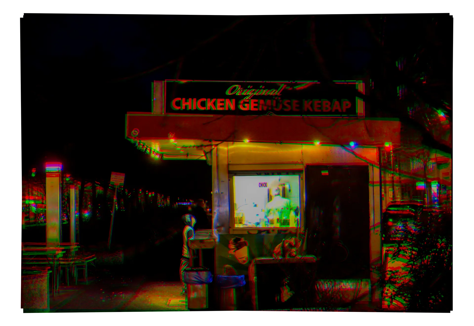 A kebab shop storefront at night
